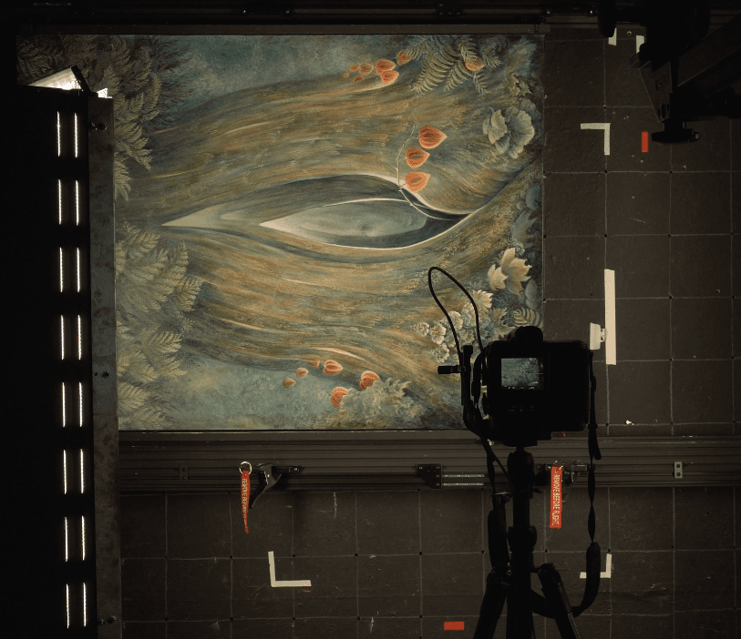 Professional camera on a tripod photographing mounted artwork under studio lighting for archival reproduction. Photo by Bellevue Fine Art Reproduction.